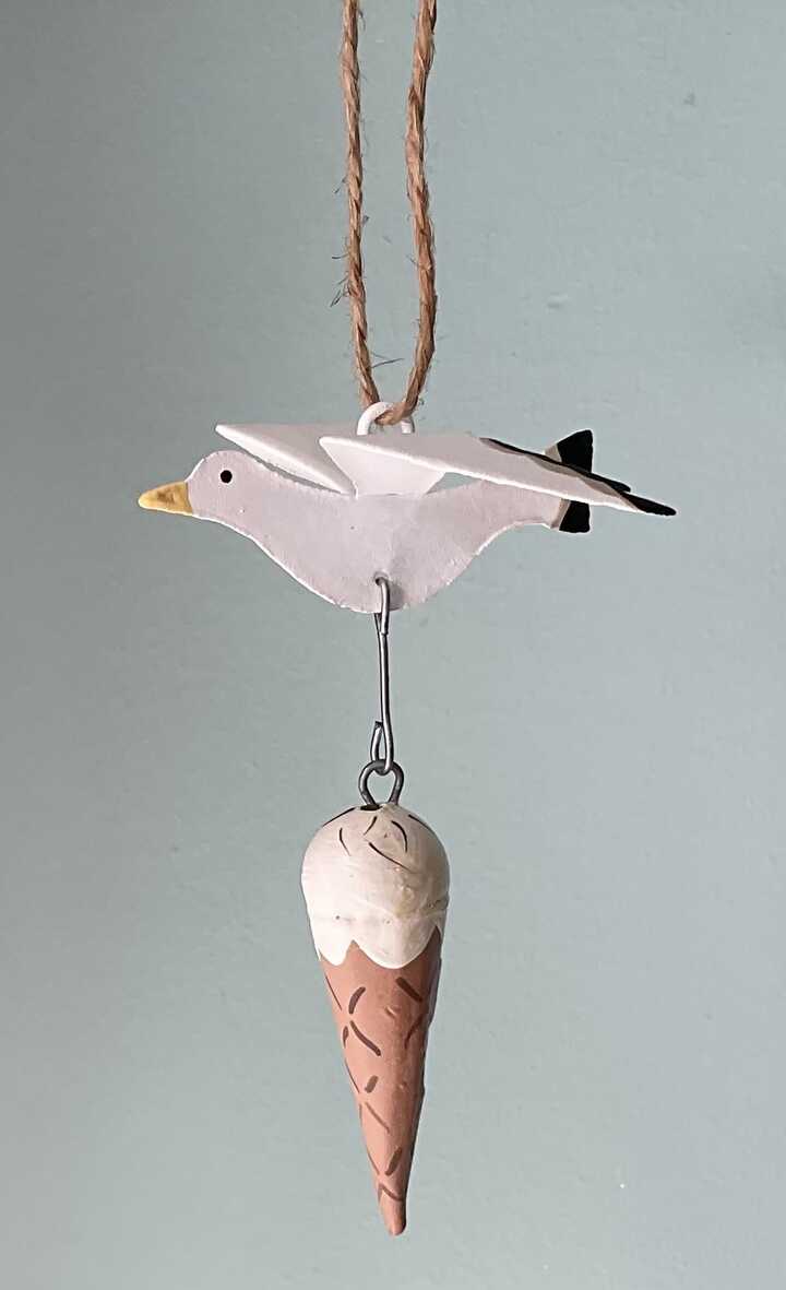 Seagull stealing an ice cream hanging decoration