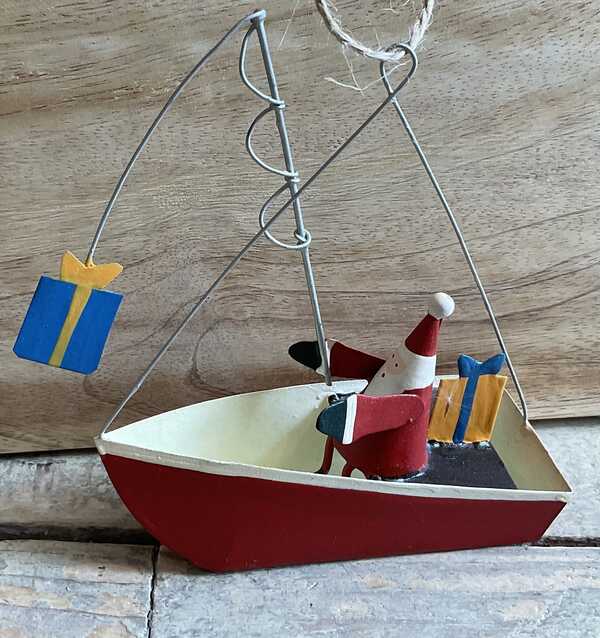 Father Christmas catching presents in a boat